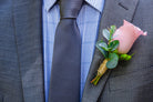 single rose hypericum eucalyptus boutonniere